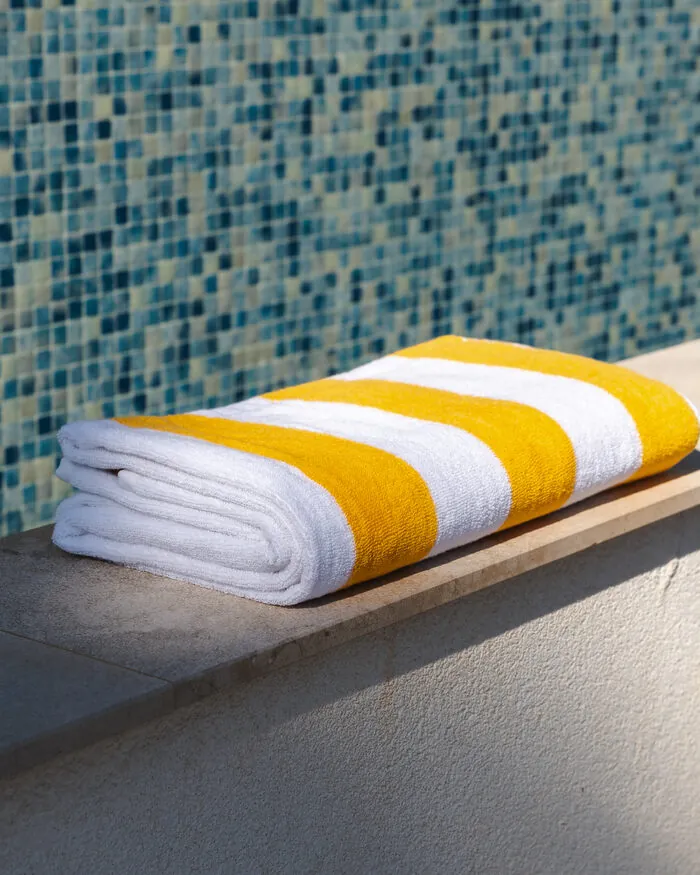 BYROSH yellow striped beach towel by the pool