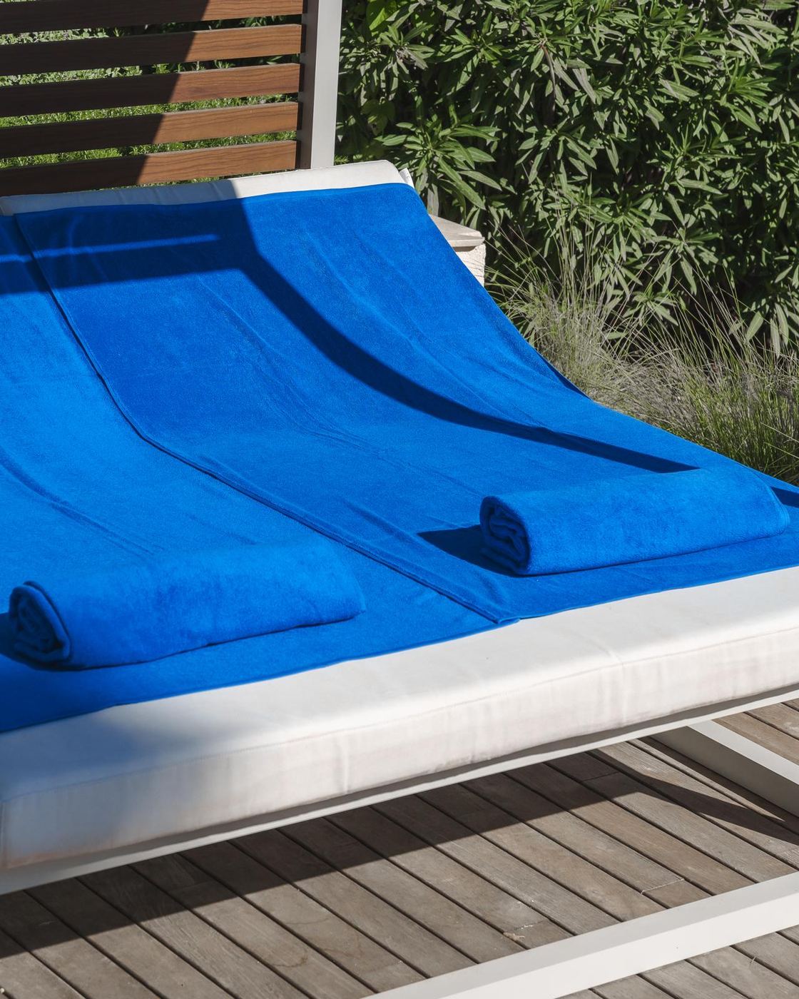BYROSH blue pool towels on a sun lounger